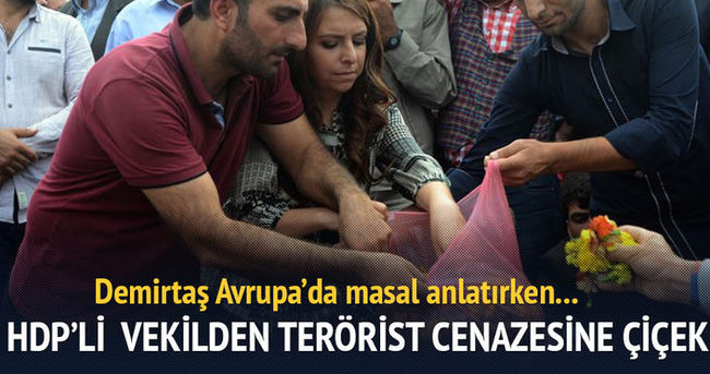 HDP’li vekil teröristin mezarına çiçek koydu