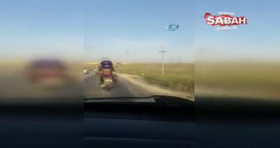 Motosikletli şahsın köpek ile tehlikeli yolculuğu kamerada